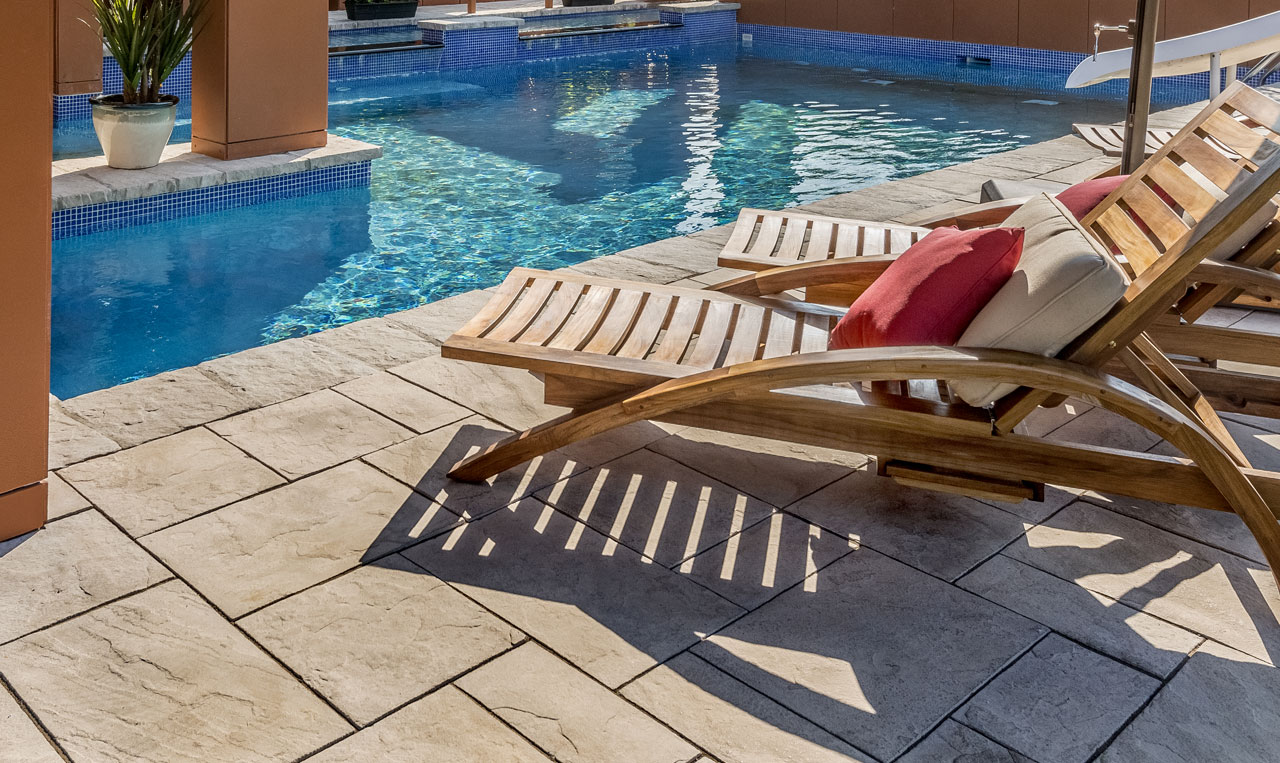 A beautiful backyard pool deck setup using Alliance Gator's Maxx Polymeric Sand line.